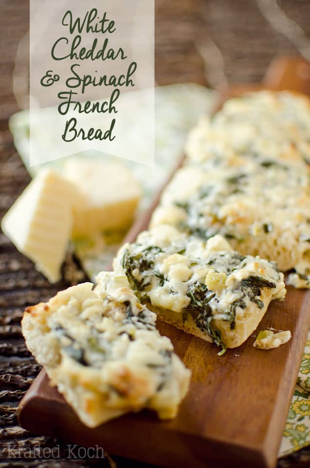 White Cheddar & Spinach French Bread - Lavibu - Crusty French bread topped with baby spinach sautéed in butter with garlic and green onions and mixed with extra sharp white cheddar for a decadent appetizer or vegetarian entrée recipe your guests will devour!