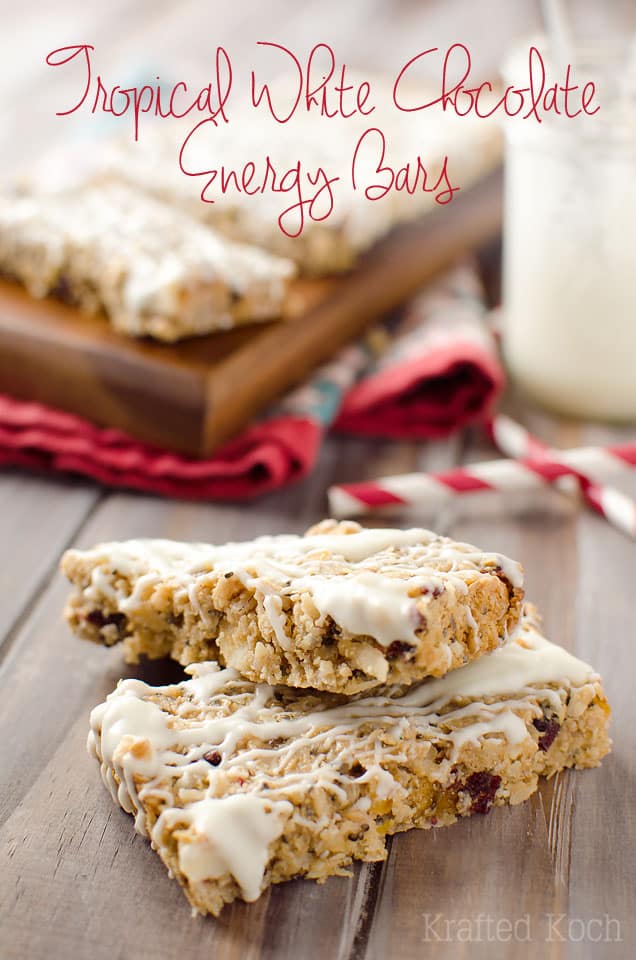 Tropical White Chocolate Energy Bars - Lavibu - Tropical White Chocolate Energy Bars are loaded with healthy grains, nut butter and sweet dried fruits all drizzled with white chocolate for a balanced energy bar that is decadently delicious! Grab one of these energy bars from the freezer for a quick breakfast or snack that will you up and leave you feeling satisfied. #Healthy #Light #Energy #Breakfast #Snack