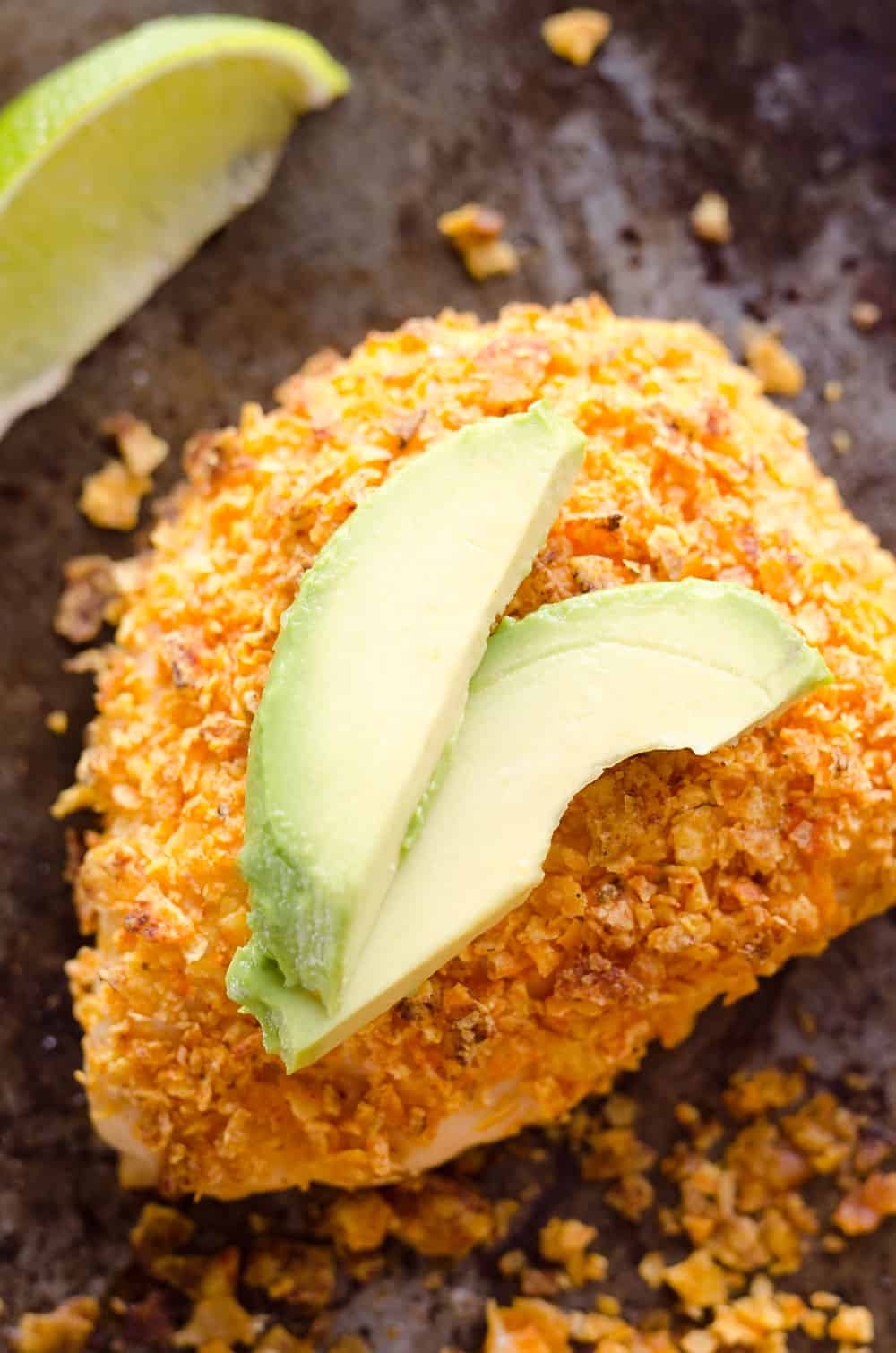 {3 Ingredient} Cheesy Dorito Chicken is a light and delicious dinner with tender chicken breasts stuffed with a creamy queso fresco cheese and coated in crunchy Dorito chips.