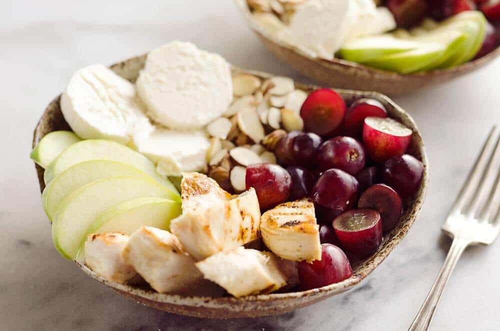Fruit & Goat Cheese Chicken Bowls are a fresh and easy recipe for a healthy dinner loaded with sweet and savory flavors. Tender chicken breasts are paired with juicy grapes, apples, almonds and creamy honey goat cheese for an amazingly simple meal!