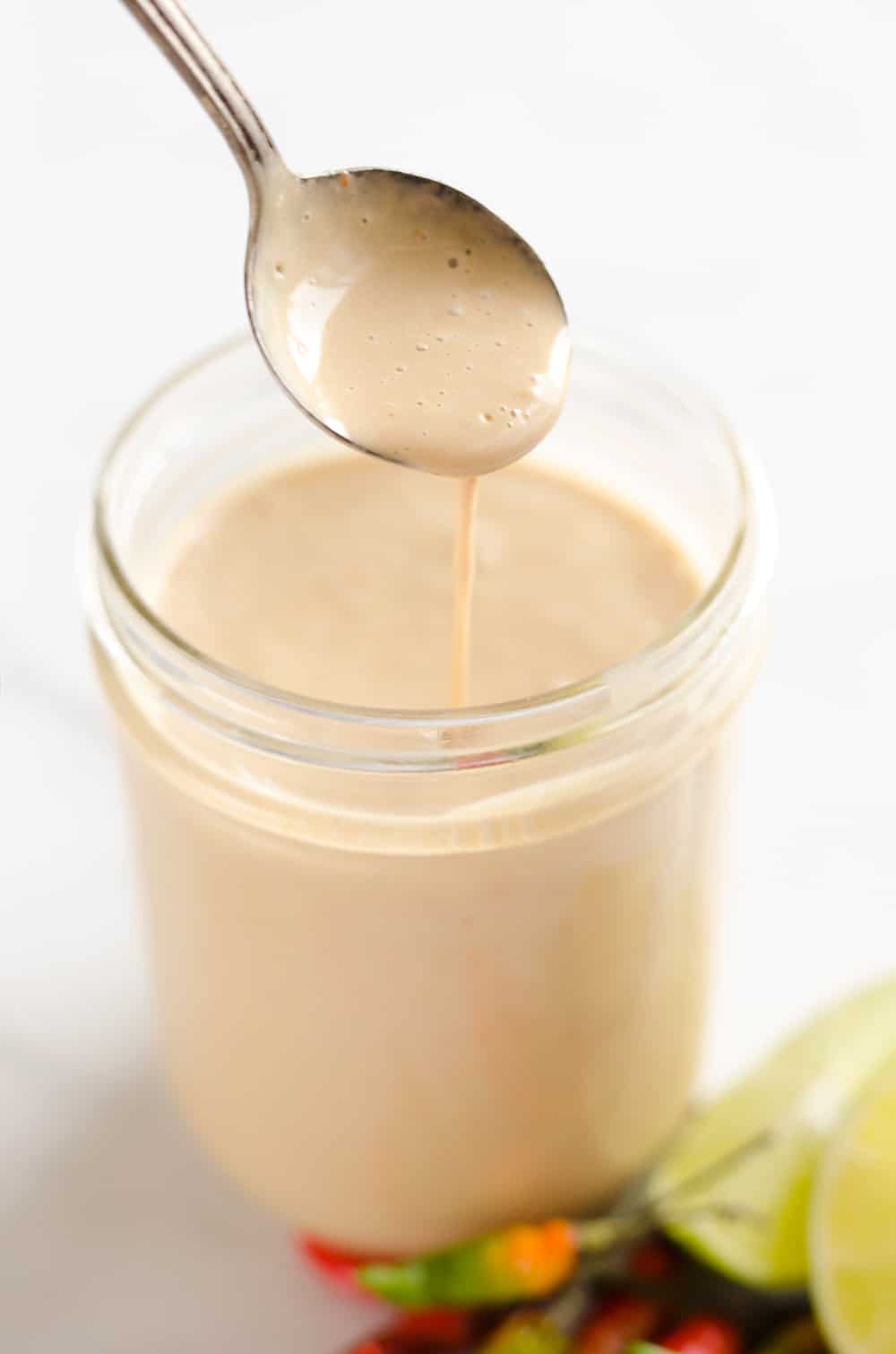 Thai Peanut Sauce is a quick sauce that is bursting with rich and spicy flavors. It is perfect on chicken or your favorite salad to kick up your meal a notch.