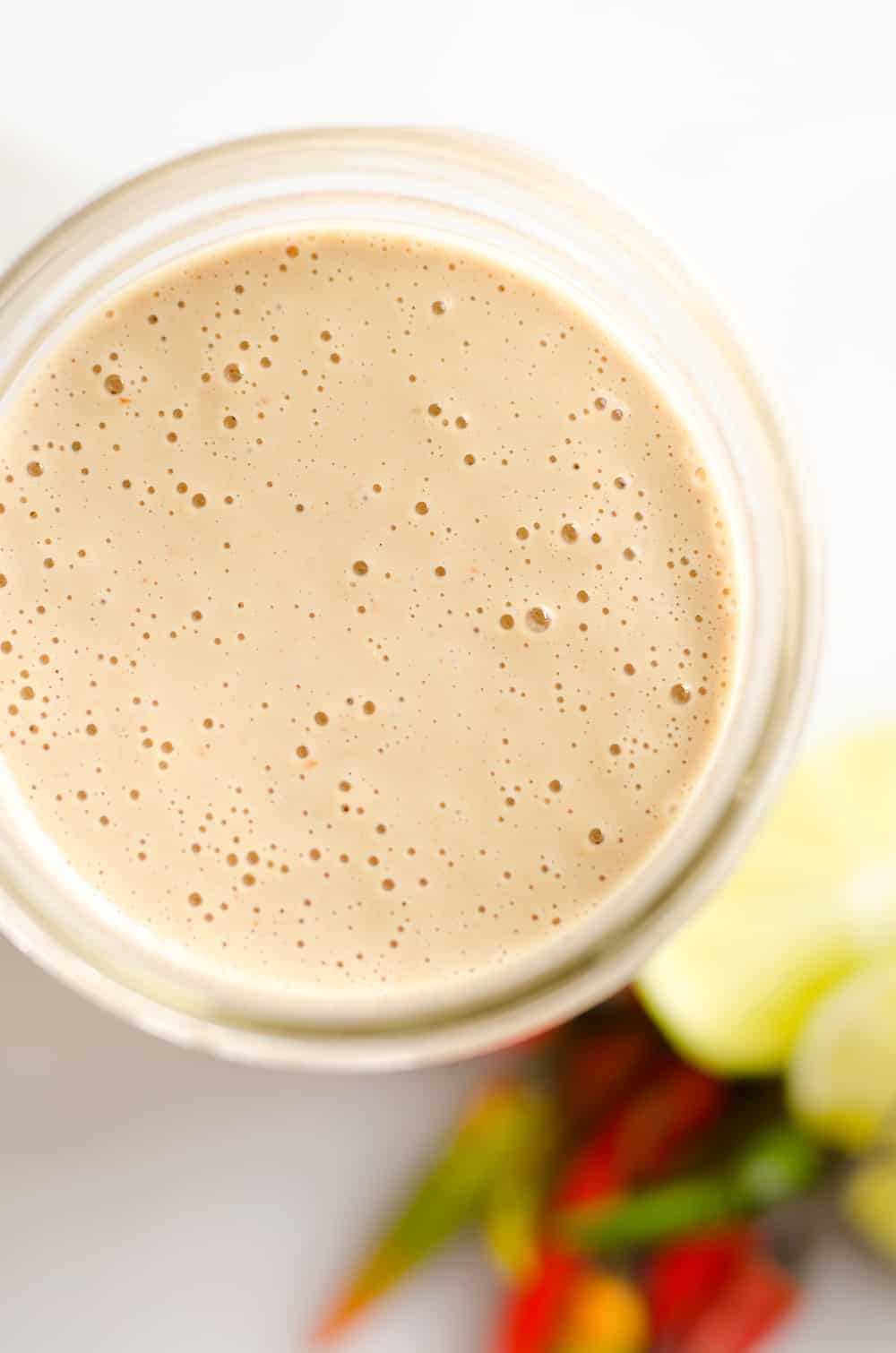 Thai Peanut Sauce is a quick sauce that is bursting with rich and spicy flavors. It is perfect on chicken or your favorite salad to kick up your meal a notch.