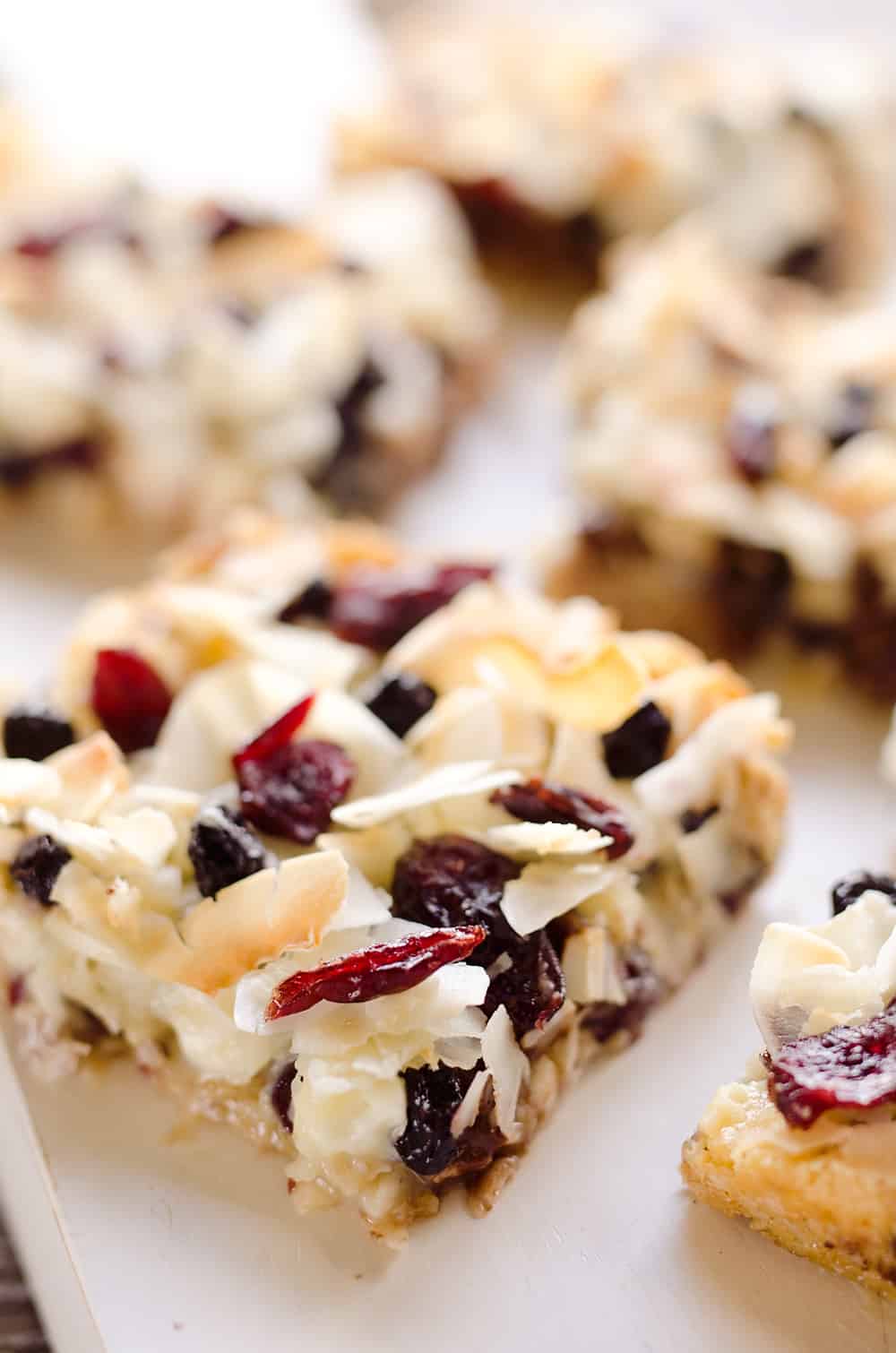 Berry Coconut Magic Bars are amazingly easy to whip together and have the great flavors of chocolate and dried berries for a fun twist on a classic dessert.