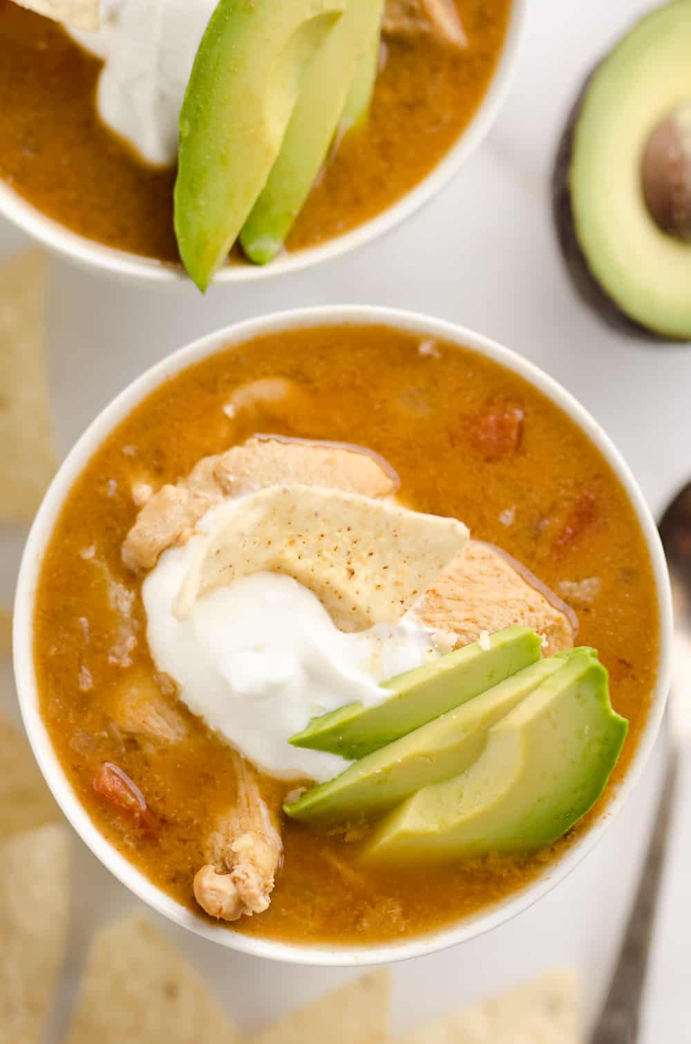 Pressure Cooker Chicken Tortilla Soup is a quick and easy soup recipe made in your Instant Pot that is bursting with bold and spicy flavors!