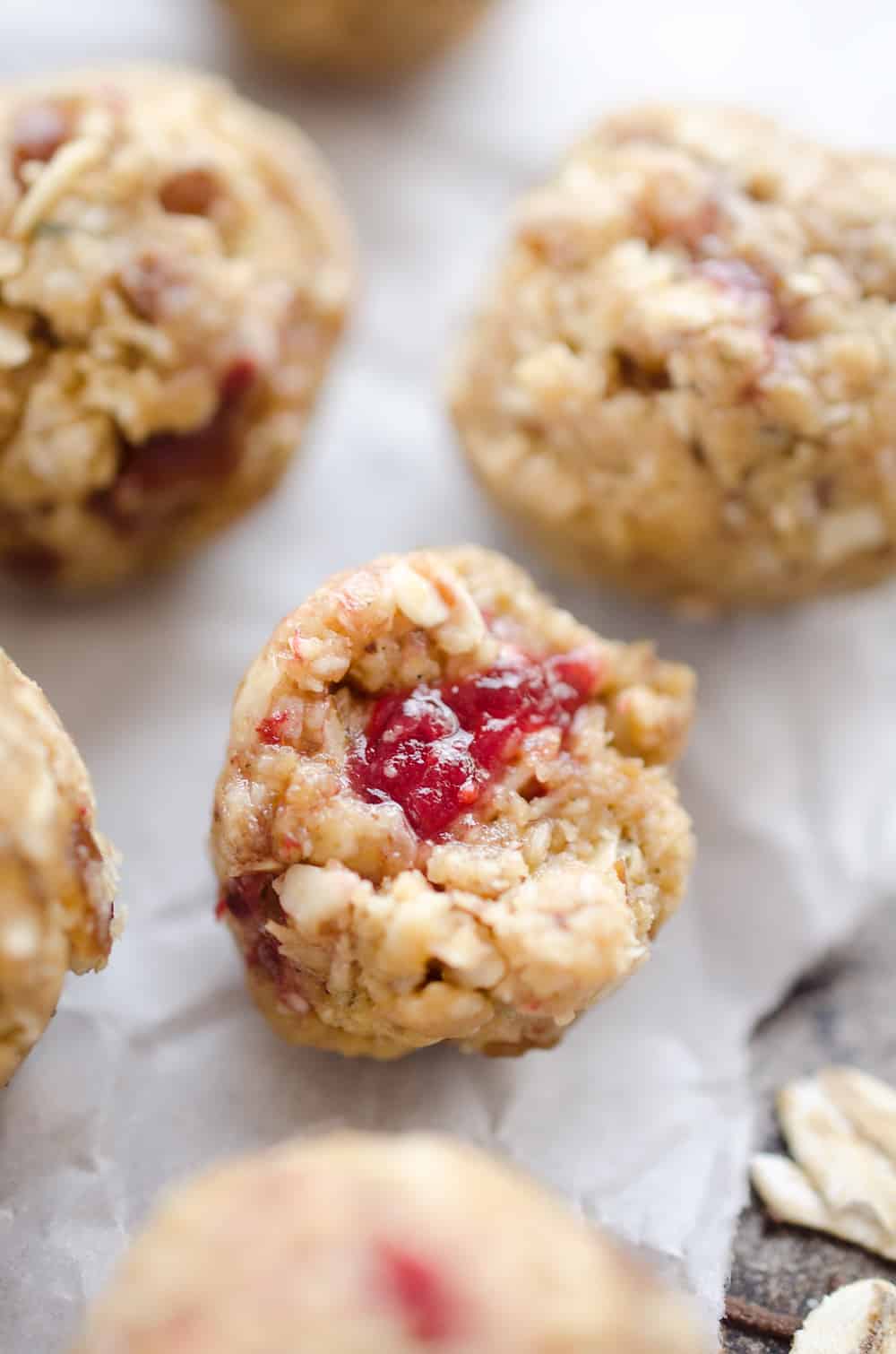 PB&J Surprise Energy Bites are a fun and healthy no bake snack with a peanut butter and oat mixture and a surprise pop of strawberry jelly on the inside.
