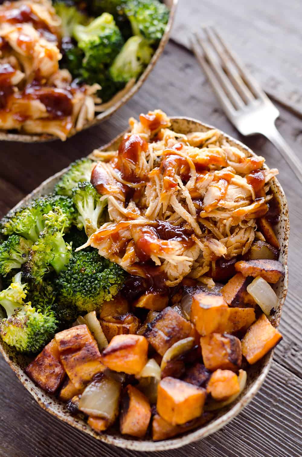 BBQ Chicken & Roasted Sweet Potato Bowls are a hearty and healthy dinner idea bursting with bold flavors and nutritious vegetables. This easy recipe is perfect for meal prepping lunches for work or a quick weeknight meal.
