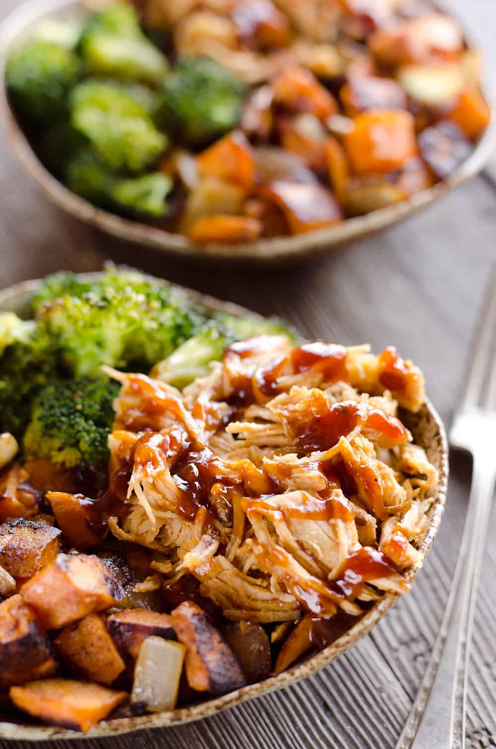 BBQ Chicken & Roasted Sweet Potato Bowls are a hearty and healthy dinner idea bursting with bold flavors and nutritious vegetables. This easy recipe is perfect for meal prepping lunches for work or a quick weeknight meal.