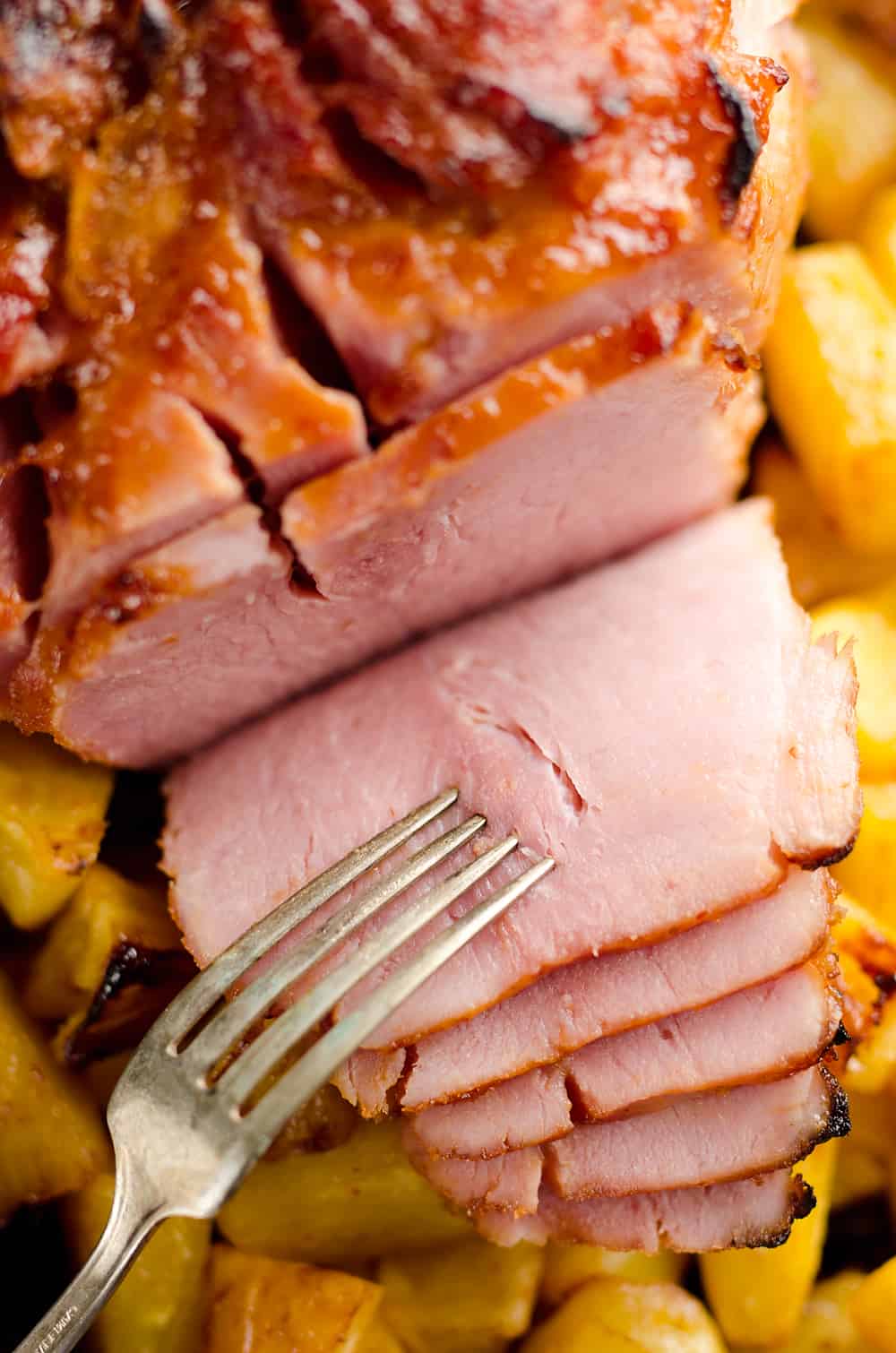 Roasted Pineapple & Chipotle Honey Ham is a sweet and spicy twist on your traditional holiday meal. This easy recipe is finished off with fresh pineapple roasted to sweet perfection for a perfect compliment to the salty and smoky ham.