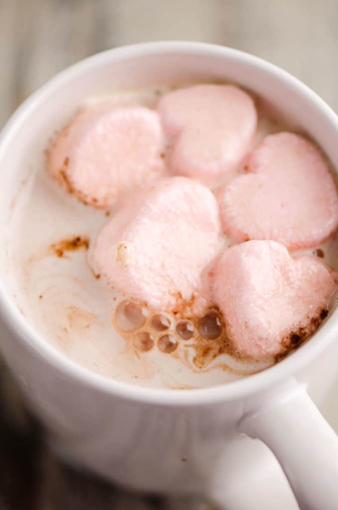 Valentines Hot Chocolate with pink heart marshmallows in a white mug